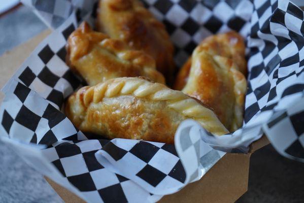 Jerk chicken, lechon and vegggie empanadas!