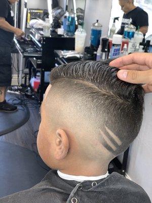 Mid bald fade with a fohawk