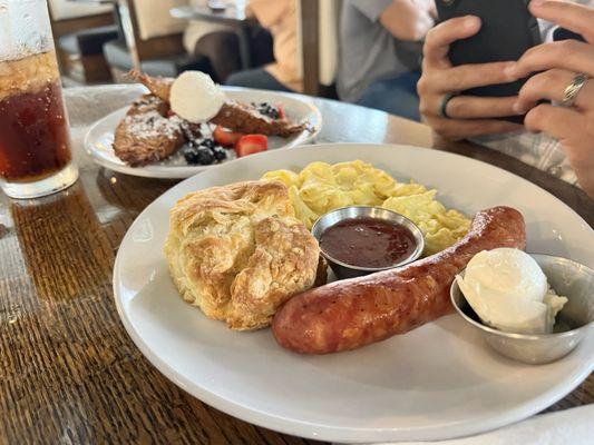 Smoked sausage, biscuit, eggs, strawberry jam