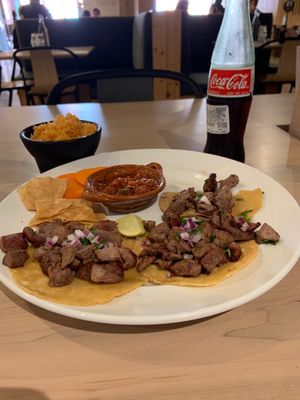 Carne Asada Tacos with Mexican rice and salsa roja