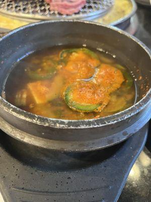 Tofu soup with jalapeños.