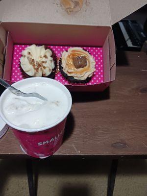 cheesecake in the vanilla ice cream and a red velvet cupcake and a snickers cupcake.