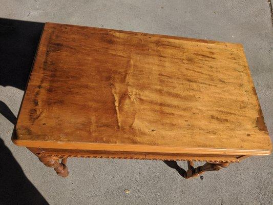 small wood veneer table. L 29"  W 16.5"  H 26"