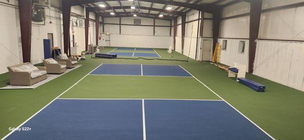 Great indoor facility, with 2 well lit, 5-layer cushioned courts. An outdoor surface that plays true and fast.