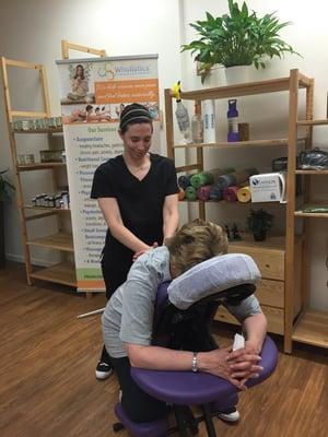 Our fabulous massage therapist treats some clients in the waiting area to a relaxing back massage :)