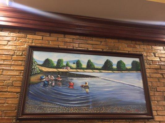 Photo of interior: Some of the paintings that hang on the wall, evokes a feeling of nostalgia for those who eat here. (11/27/2017)