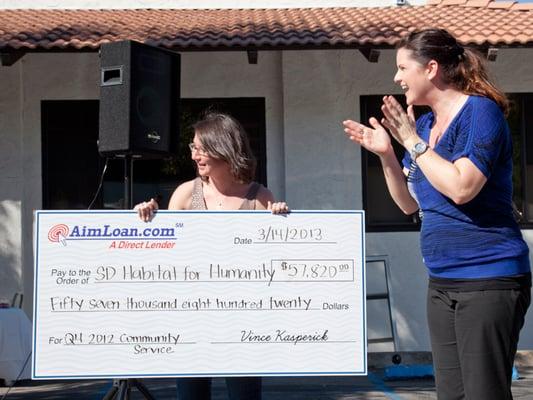 San Diego Habitat for Humanity spokesperson is presented with AimLoan's quarterly Community Service Website Campaign check.