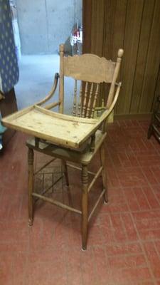 Child's high chair in need of restoration and refinishing.  The chair was missing the foot rest, seat caining, and lower rung.