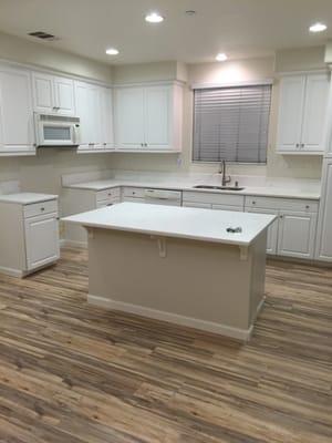 Countertop Installation, New Laminate Floors, Upgraded Baseboards - After Kitchen Photo