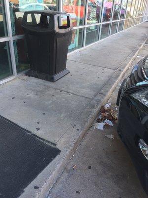 Parking lot trash ... and the trash can is right there. Put you walked passed this to open the doors to the store