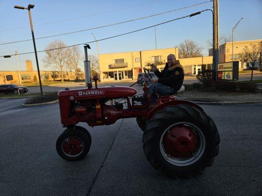 Manger Rick putting away their classic tractor