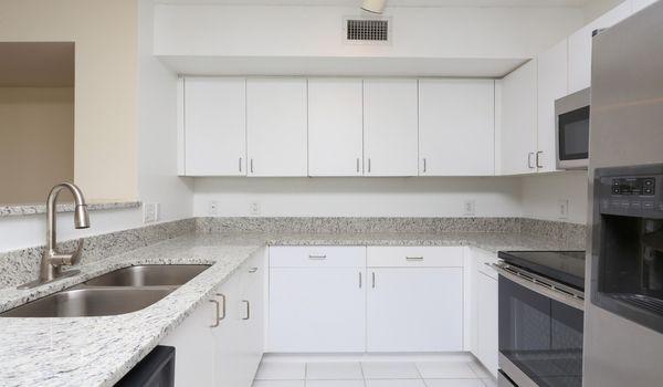 Kitchen features stainless steel appliances and granite countertops