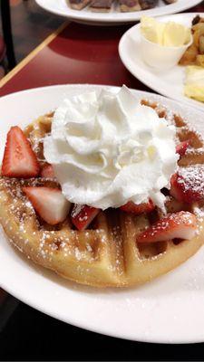 Waffle with fresh whip and Strawberries..