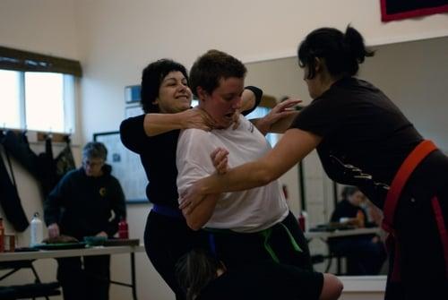 Rear choke/grab self defense scenario. Photo courtesy Bonnie Loshbaugh.