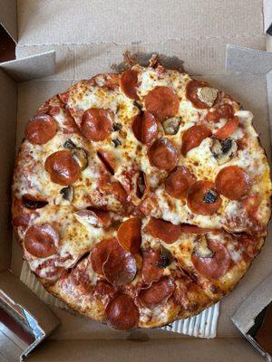 Pan pizza with pepperoni and mushrooms