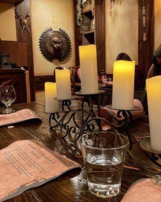 The communal table with menus and waters