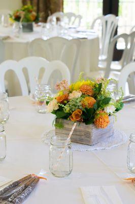 Gorgeous floral centerpieces with a tad of rustic charm.