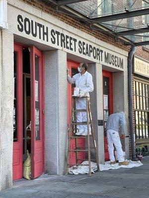 Re-painting South Street Seaport Exterior Doors.