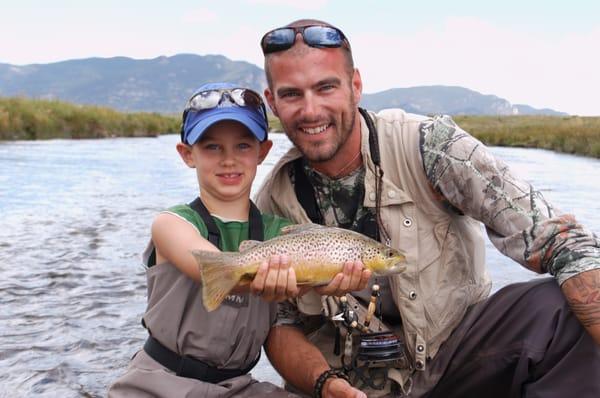 Father and son enjoy a moment of success. Photo by Blue Quill Guide John Keefover