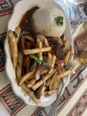 Lomo Saltado ( beef and French fries with white rice)