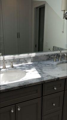 Single sink vanity transformed into double sink vanity.