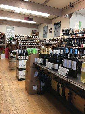 A view of our wine room with our Table where you can find a rotating selection of feature wines!