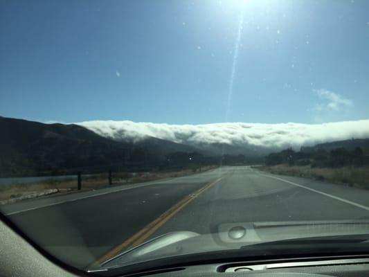 Fog rolling in over the hill.