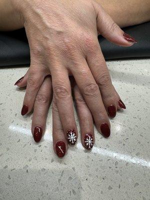 Christmas sparkly red nails with custom snowflake design