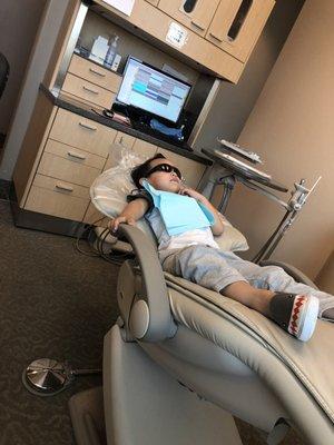 Netflix and chillin while he waits to get his teeth cleaned!