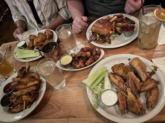 left to right: chicken strips, mango habanero wings, cheese curds, whisky burger, brown sugar bourbon wings