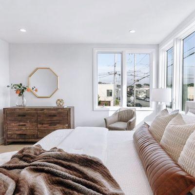 Elegant and sleek Primary bedroom with warm and neutral colors.