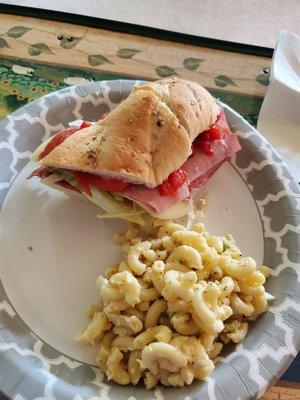 Half of the D'Italia sub cut in half and macaroni salad. Both are 10 out of 10 amazing