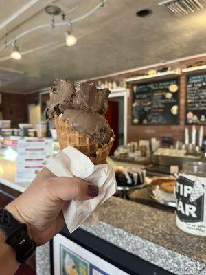 Chocolate ice cream with a waffle cone