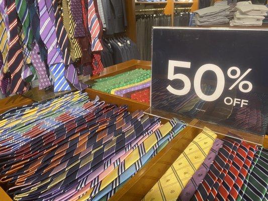 Neck ties priced at $39.75 each after the 50% markdown.