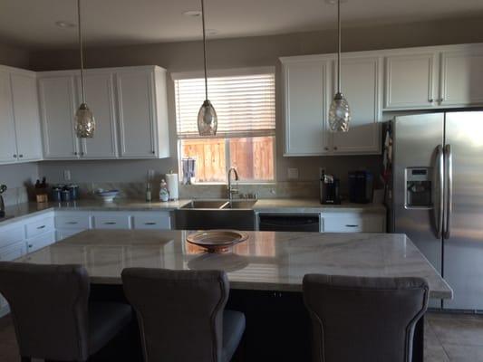 After: LED lights, LED recessed fixtures, under cabinet lighting, new countertops, apron front sink, new faucet, new blinds