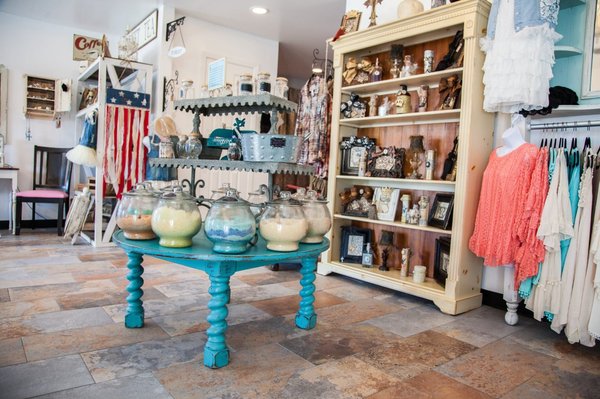 Lots of boutique items including candles, frames, and womens and childrens clothing from Paisley Vine and Little Sassy