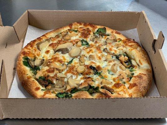 White pizza with spinach and mushrooms