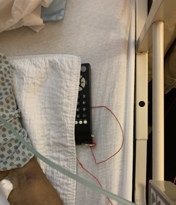 Remote connected to a red cord