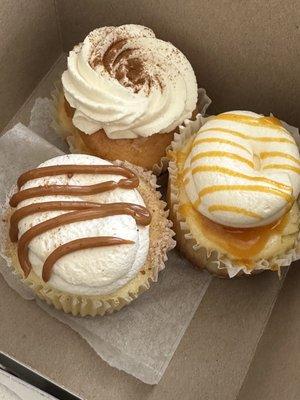 Tres leches cupcake on top. Churro cheesecake & Passion fruit cheesecake.  All so delicious