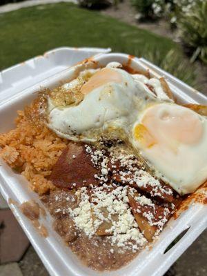 Red Chilaquiles w/ Sunny Side Eggs  Served with rice & beans