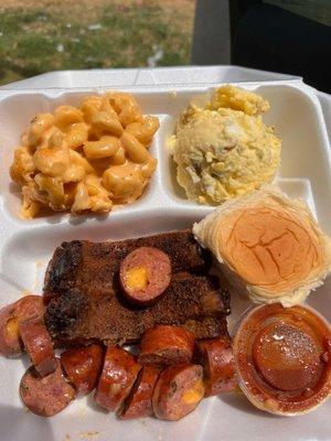 2 meats with 2 sides. Pork ribs and jalepeno cheddar sausage with potato salad and Mac n cheese