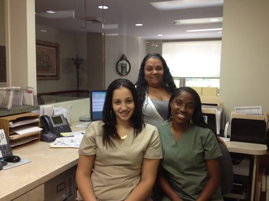 Our welcolming Staff, Luisette and Ayanna in front and Denise standing behind them