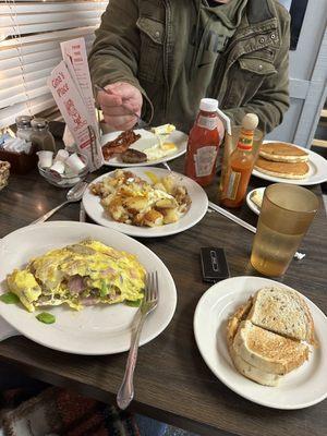 Western omelette, potatoes, and blueberry pancakes.