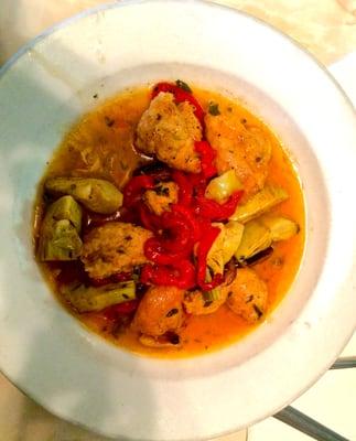 Chicken Campagnola: lightly breaded chicken, artichoke hearts, roasted red peppers, roasted garlic in a white wine sauce.