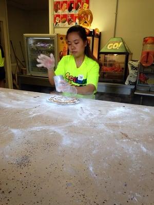 Action Park employee making Funnel Cake