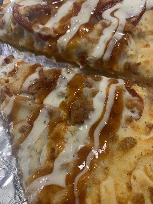 Closeup of the sauce Spicy Chicken Bacon Ranch pizza