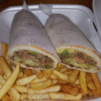 Cheese steak combo served with fries and a can of soda