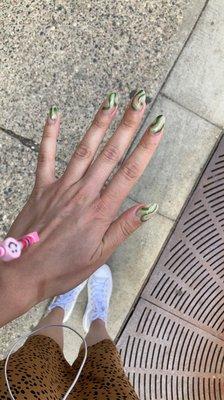 Clear nails with green shapes