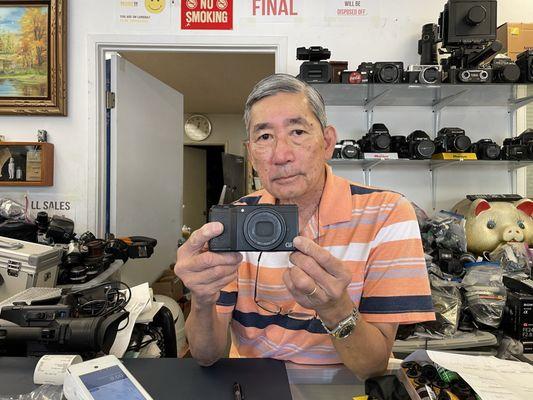 Mr. Phuong with my repaired Ricoh GR II.