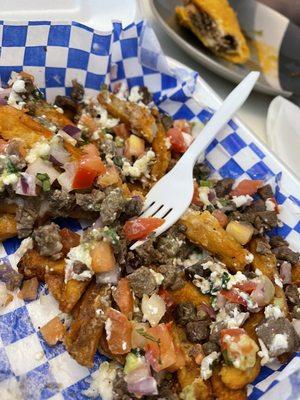 Carne asada fries (half eaten sorry but they look way better before)